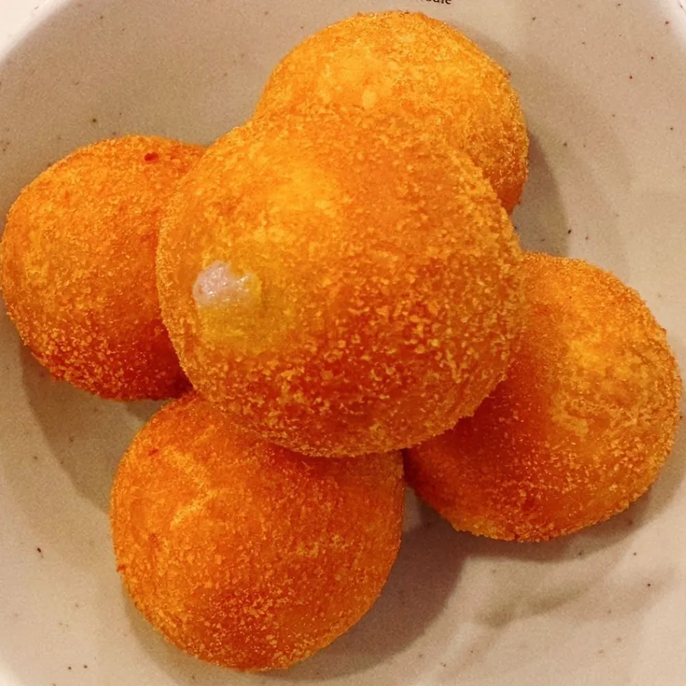Crispy fried taro balls with oozing sweet filling at Ten Seconds Yunnan Rice Noodle, a Chinese Restaurant in Syosset